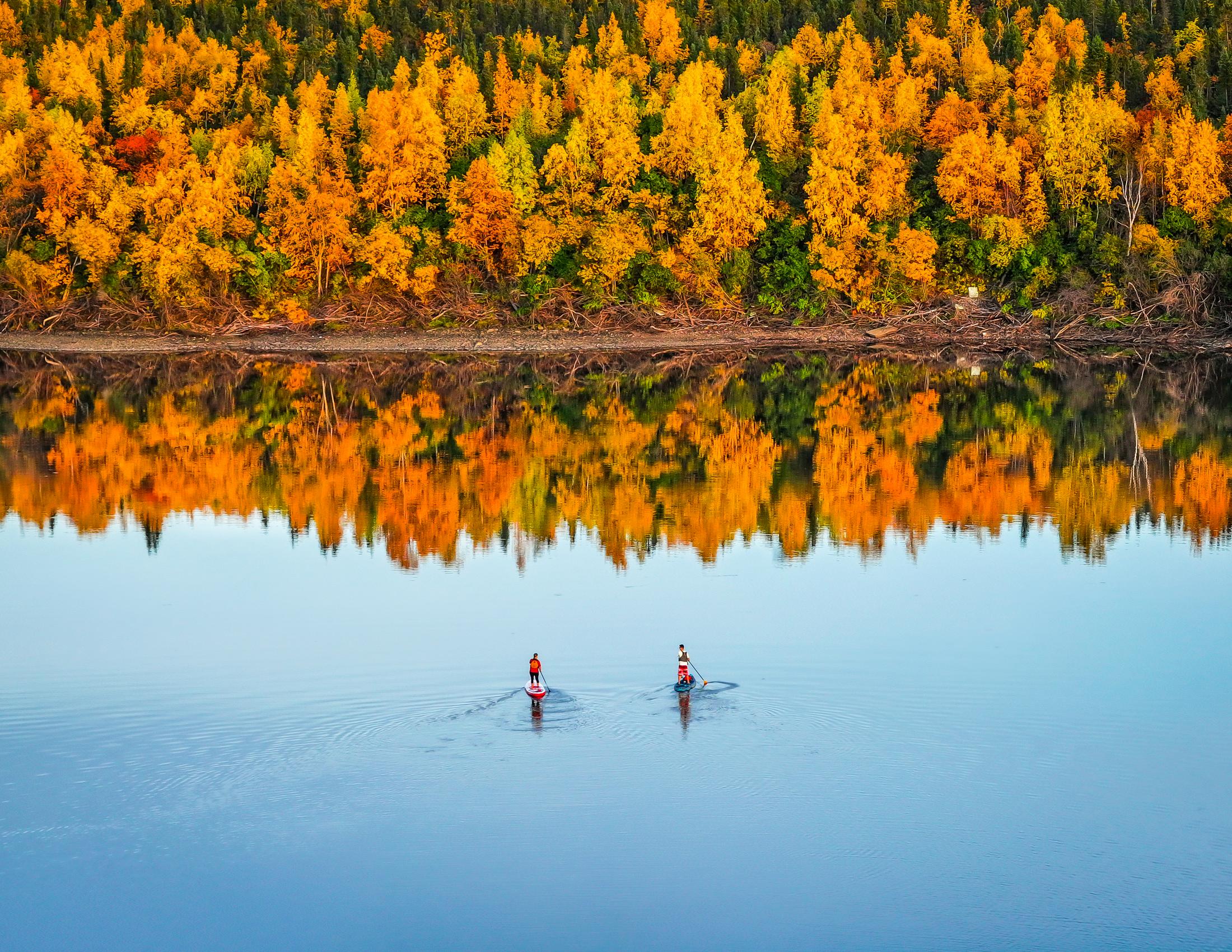 Paddle boarding in Inuvik, Boot lake in the fall in the NWT. Photo Kristian Binder