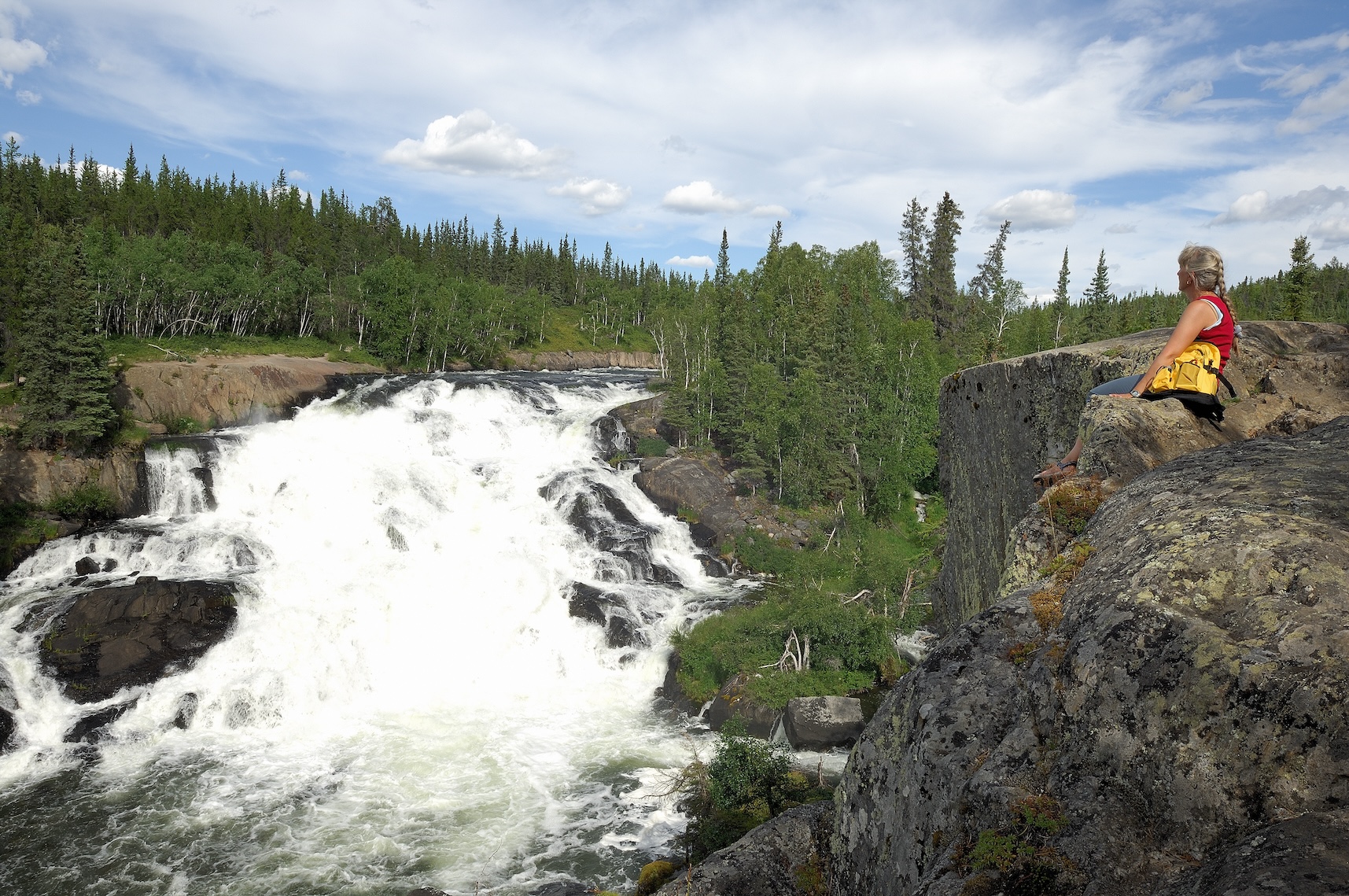 Aperson enjoys the views of Cameron Falls outside of Yellowknife NWT_. Photo Hans Pfaff