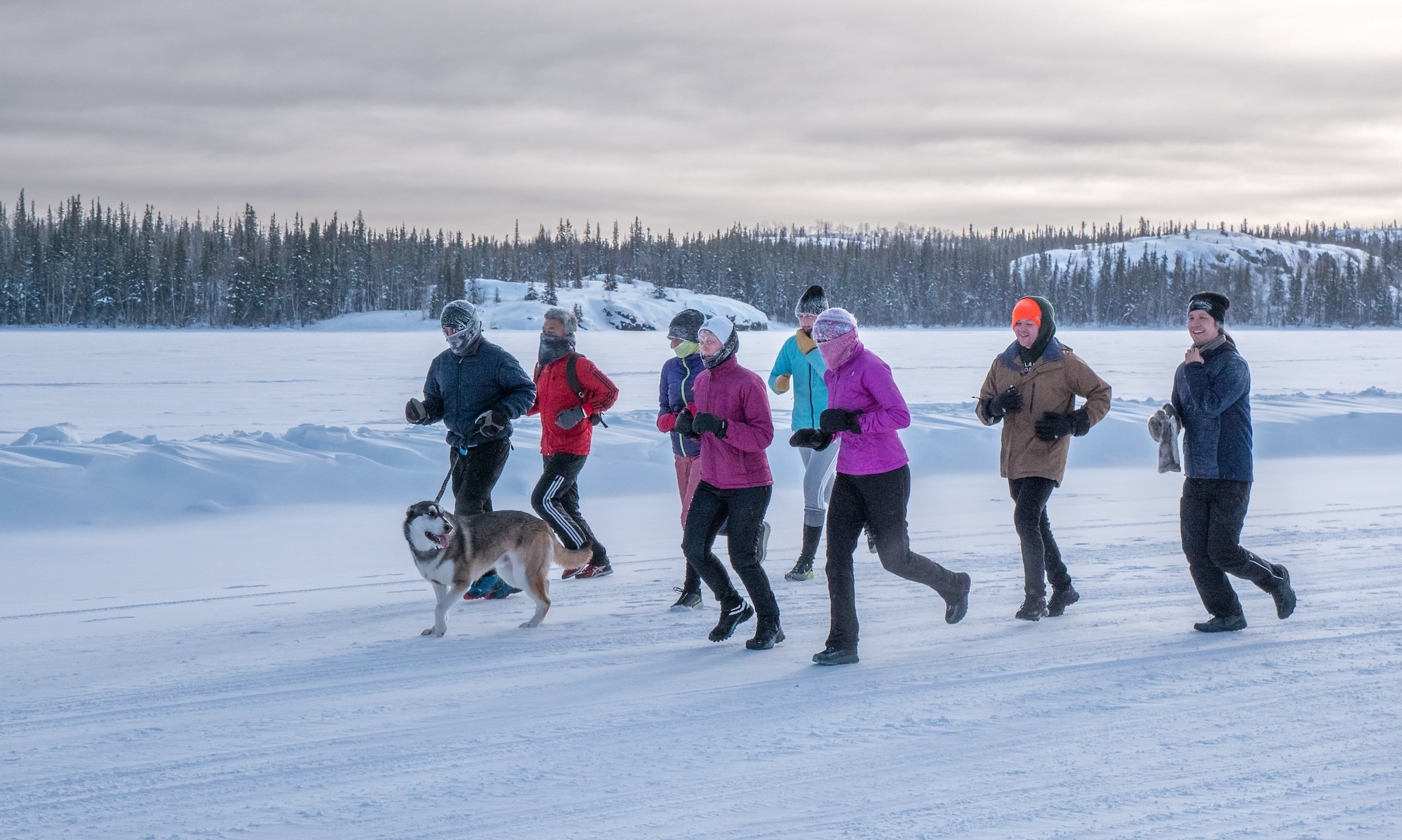 A group of people running on the ice road in the NWT_. Photo credit Mike Lee